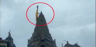 ભારે વરસાદને પગલે જગતમંદિર દ્વારકાધીશની ધજા અડધી કાઠીએ ફરકાવાઈ! Following heavy rains, the flag of Jagatmandir Dwarkadhish was hoisted at half-mast